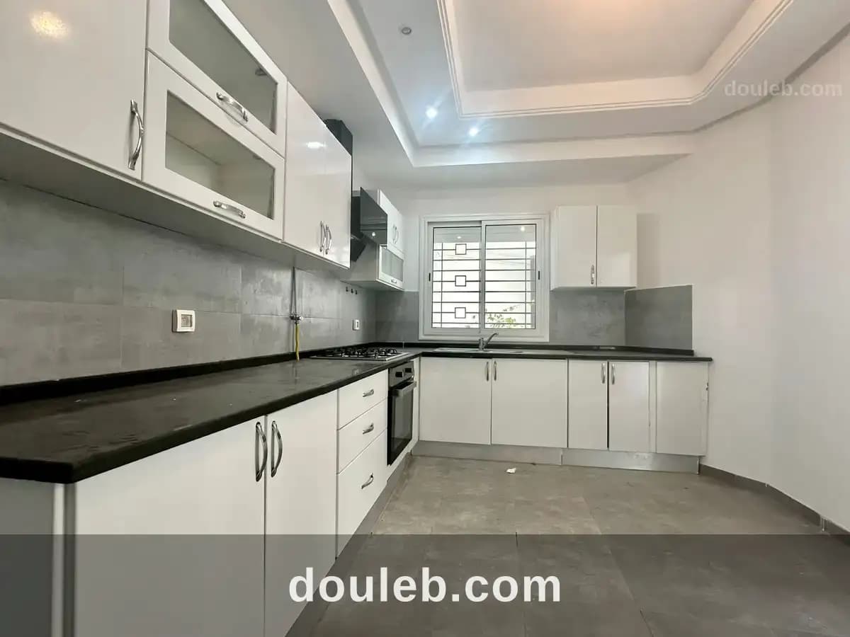 Appartement s2 avec jardin à cité ennasr à Ariana