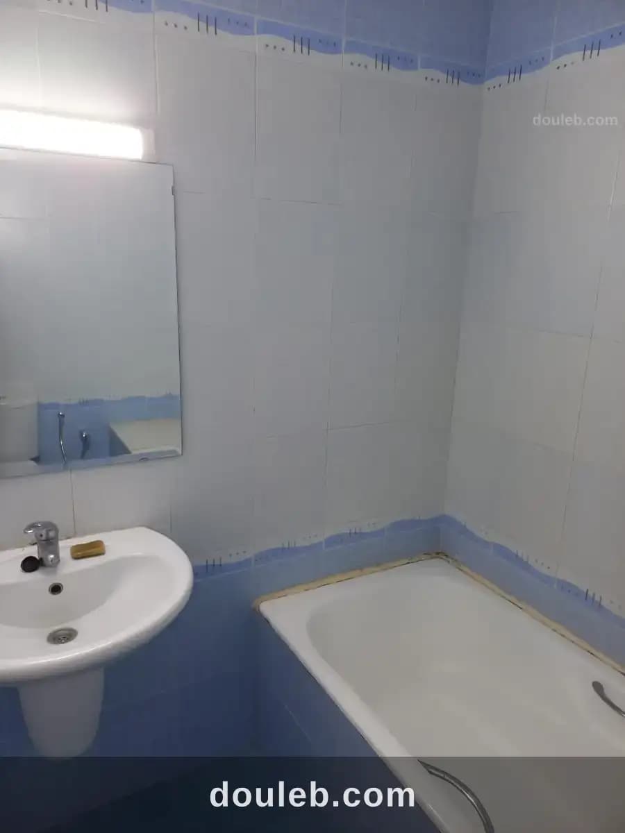 Un appartement s 2 cité nasr 2 - Miniature 5