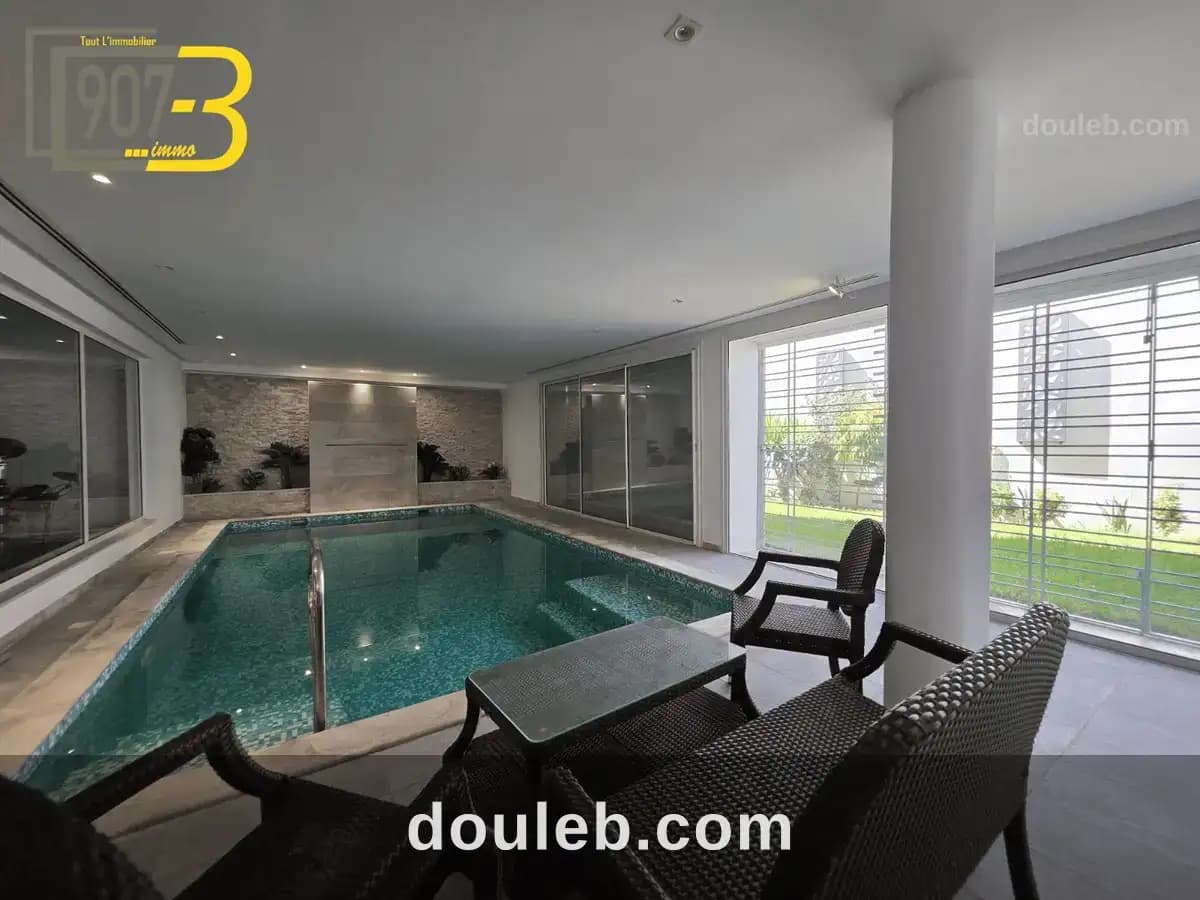 Villa s4 avec piscine intérieure à el menzah 9 - Miniature 2
