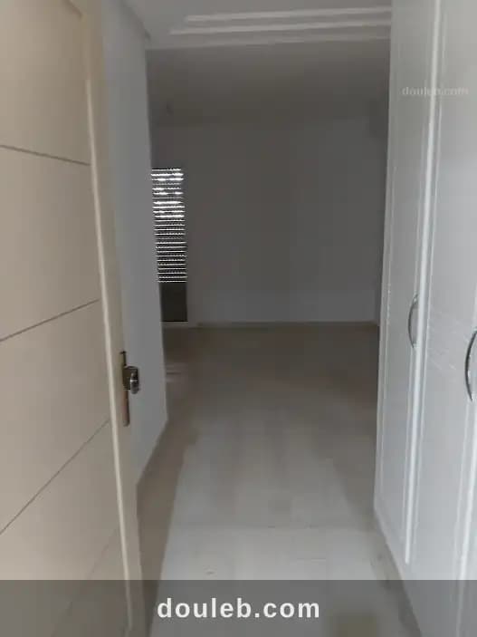 Appart rdc residence elbousten bor louzir - Miniature 2